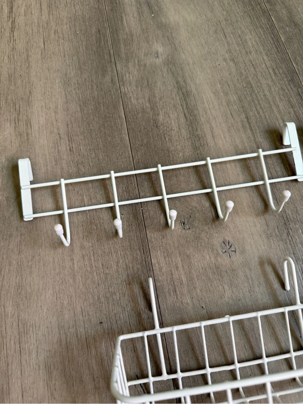 White baskets and hooks